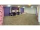 Playful basement featuring a climbing wall and custom shelving at 15303 E Rio Verde Dr, Scottsdale, AZ 85262