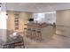 Modern kitchen with a central island, wine storage, and stainless steel appliances at 4849 N Camelback Ridge Rd # A409, Scottsdale, AZ 85251