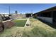 View of the pool, patio and outdoor kitchen in the backyard at 5007 W Weldon Ave, Phoenix, AZ 85031