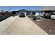 Charming blue single-story home featuring a long driveway and potential backyard oasis at 5007 W Weldon Ave, Phoenix, AZ 85031