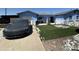 Charming blue single-story home featuring newly installed artificial grass and rock details at 5007 W Weldon Ave, Phoenix, AZ 85031