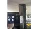 Modern kitchen features stainless steel range hood and black cabinetry for a sleek, contemporary look at 5007 W Weldon Ave, Phoenix, AZ 85031