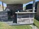 Outdoor kitchen and covered area with a sink, barbeque and eating area at 5007 W Weldon Ave, Phoenix, AZ 85031