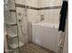 Bathroom featuring a luxurious soaking tub and shower with decorative tile accents at 19595 N Sunburst Way, Surprise, AZ 85374