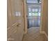 Entryway leading to a living room with bay windows and hardwood flooring at 19595 N Sunburst Way, Surprise, AZ 85374