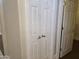 This is a view of the hallway closet with bi-fold doors and gold hardware at 19595 N Sunburst Way, Surprise, AZ 85374