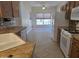 Eat-in kitchen with large window, modern appliances, and warm cabinets at 19595 N Sunburst Way, Surprise, AZ 85374