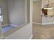 Bright kitchen featuring an island and tiled flooring, perfect for entertaining at 19595 N Sunburst Way, Surprise, AZ 85374