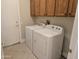 This is a view of the laundry room, including a washer and dryer at 19595 N Sunburst Way, Surprise, AZ 85374