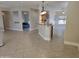 Open-concept living area showcases bar seating between kitchen and living room at 19595 N Sunburst Way, Surprise, AZ 85374