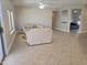 Spacious living room area with neutral paint and tile flooring, large windows with natural light at 19595 N Sunburst Way, Surprise, AZ 85374
