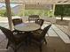 Outdoor patio featuring wicker furniture and a pergola, perfect for relaxing and entertaining guests at 19595 N Sunburst Way, Surprise, AZ 85374