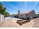 Spacious backyard with a pool, covered patio, and desert landscaping at 1660 N 59Th St, Mesa, AZ 85205
