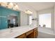 Bright bathroom with double sinks, a large mirror, and a soaking tub at 1660 N 59Th St, Mesa, AZ 85205