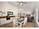 Bright dining area adjacent to the kitchen and living room, featuring modern lighting and stylish decor for Gathering meals at 1660 N 59Th St, Mesa, AZ 85205