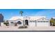 Charming home with a well-manicured front yard and a three car garage, providing curb appeal and practicality at 1660 N 59Th St, Mesa, AZ 85205