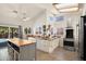 Well-lit kitchen with a butcher block island, modern appliances, and ample storage, perfect for cooking and entertaining at 1660 N 59Th St, Mesa, AZ 85205