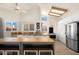 Stylish kitchen with an island, stainless steel appliances, and lots of natural light, perfect for the culinary enthusiast at 1660 N 59Th St, Mesa, AZ 85205