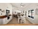 Open concept living space featuring a dining area, a cozy seating area, and large windows, perfect for modern living at 1660 N 59Th St, Mesa, AZ 85205