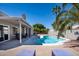 Backyard pool with covered patio and lush landscaping, perfect for outdoor entertaining at 1660 N 59Th St, Mesa, AZ 85205