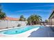 Inviting backyard pool with desert landscaping, palm trees, and sunny lounge area at 1660 N 59Th St, Mesa, AZ 85205