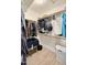 A walk-in closet with plenty of storage space, shelves, and hanging rods to keep you organized at 1660 N 59Th St, Mesa, AZ 85205