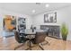 Bright dining area with a modern table and chairs, and access to the backyard at 8650 E Jackrabbit Rd, Scottsdale, AZ 85250