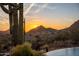 Arizona backyard featuring a pool overlooking a scenic view of a mountain at sunset at 24724 N 119Th Pl, Scottsdale, AZ 85255
