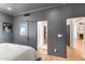 Comfortable bedroom with grey walls, wooden floors and multiple entryways at 24724 N 119Th Pl, Scottsdale, AZ 85255