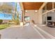 A covered patio features exposed beams, a desert garden, and seamless indoor-outdoor living at 24724 N 119Th Pl, Scottsdale, AZ 85255
