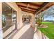 A covered patio has a seamless transition from inside to outside with views of the desert landscape at 24724 N 119Th Pl, Scottsdale, AZ 85255