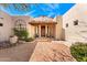 Inviting front entrance with a brick courtyard, tiled roof portico, and Southwest architectural design at 24724 N 119Th Pl, Scottsdale, AZ 85255