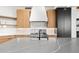 Bright modern kitchen featuring a large island, stainless steel appliances, and light wood cabinets at 24724 N 119Th Pl, Scottsdale, AZ 85255