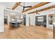 Kitchen with beamed ceiling, center island with seating, wet bar, and ample natural light at 24724 N 119Th Pl, Scottsdale, AZ 85255