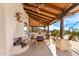 An inviting outdoor dining area features a fireplace, desert views, and a tranquil atmosphere at 24724 N 119Th Pl, Scottsdale, AZ 85255