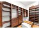 Spacious walk-in closet featuring custom shelving and drawers for optimal organization at 24724 N 119Th Pl, Scottsdale, AZ 85255
