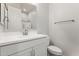 Clean bathroom with white vanity and a large mirror at 16400 W Avenida Del Sol --, Surprise, AZ 85387