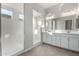 Modern bathroom with double vanity and walk-in shower at 16400 W Avenida Del Sol --, Surprise, AZ 85387