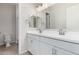 Double vanity bathroom with white cabinets and a large mirror at 16400 W Avenida Del Sol --, Surprise, AZ 85387
