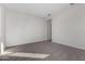 Spacious bedroom featuring carpet and access to hallway at 16400 W Avenida Del Sol --, Surprise, AZ 85387