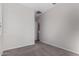 Bedroom with carpet, door, and access to hallway at 16400 W Avenida Del Sol --, Surprise, AZ 85387
