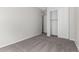 Bedroom with carpet flooring and mirrored closet doors at 16400 W Avenida Del Sol --, Surprise, AZ 85387