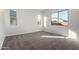 Bright bedroom with carpet flooring and large windows at 16400 W Avenida Del Sol --, Surprise, AZ 85387