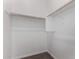 Bright closet with hanging rods and shelving at 16400 W Avenida Del Sol --, Surprise, AZ 85387