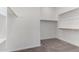 Large walk-in closet with double hanging rods at 16400 W Avenida Del Sol --, Surprise, AZ 85387