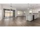 Bright dining area with hardwood floors and sliding glass doors to patio at 16400 W Avenida Del Sol --, Surprise, AZ 85387