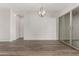 Dining area with hardwood floors and sliding glass doors at 16400 W Avenida Del Sol --, Surprise, AZ 85387