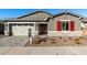 Single-story home with gray exterior, red shutters, and a paved driveway at 16400 W Avenida Del Sol --, Surprise, AZ 85387