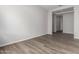 Light and airy hallway with wood-look flooring at 16400 W Avenida Del Sol --, Surprise, AZ 85387