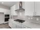 Modern kitchen boasts white cabinets, stainless steel appliances, and quartz countertops at 16400 W Avenida Del Sol --, Surprise, AZ 85387